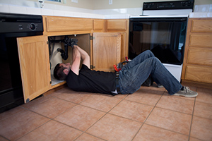 Todd, one of our Foster City garbage disposal repair pros is under the sink fixing a unit