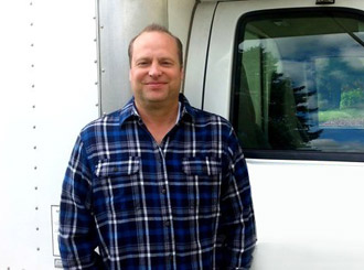 plumber near truck Paul, one of our Foster City plumbers is standing ready by his truck