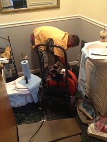 drain cleaning Peter is in the middle of a toilet drain cleaning job
